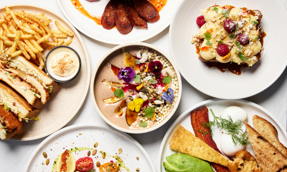 Gold Coast brunch spread at The Winey Cow, featuring eggs, Smashed Avo, fried chicken sandwich and fries